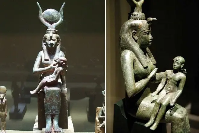 Goddess Isis su kūdikių kalnu ant rankų