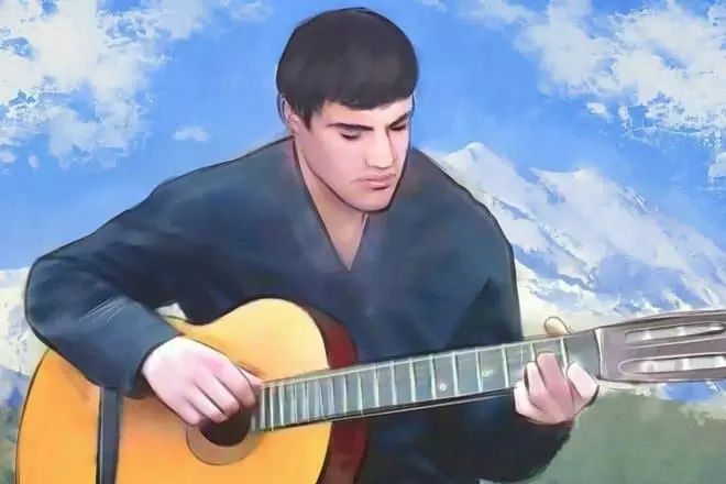 Ritratto di Timur Mutsuraev con una chitarra