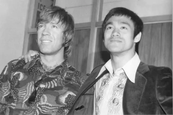 Chuck Norris at Bruce Lee.