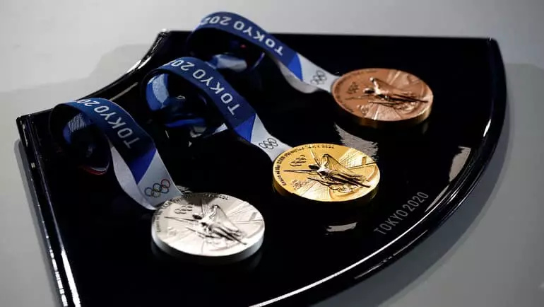 Athletes with a lot of medals of the Olympics - in different years, achievements, sport, victory